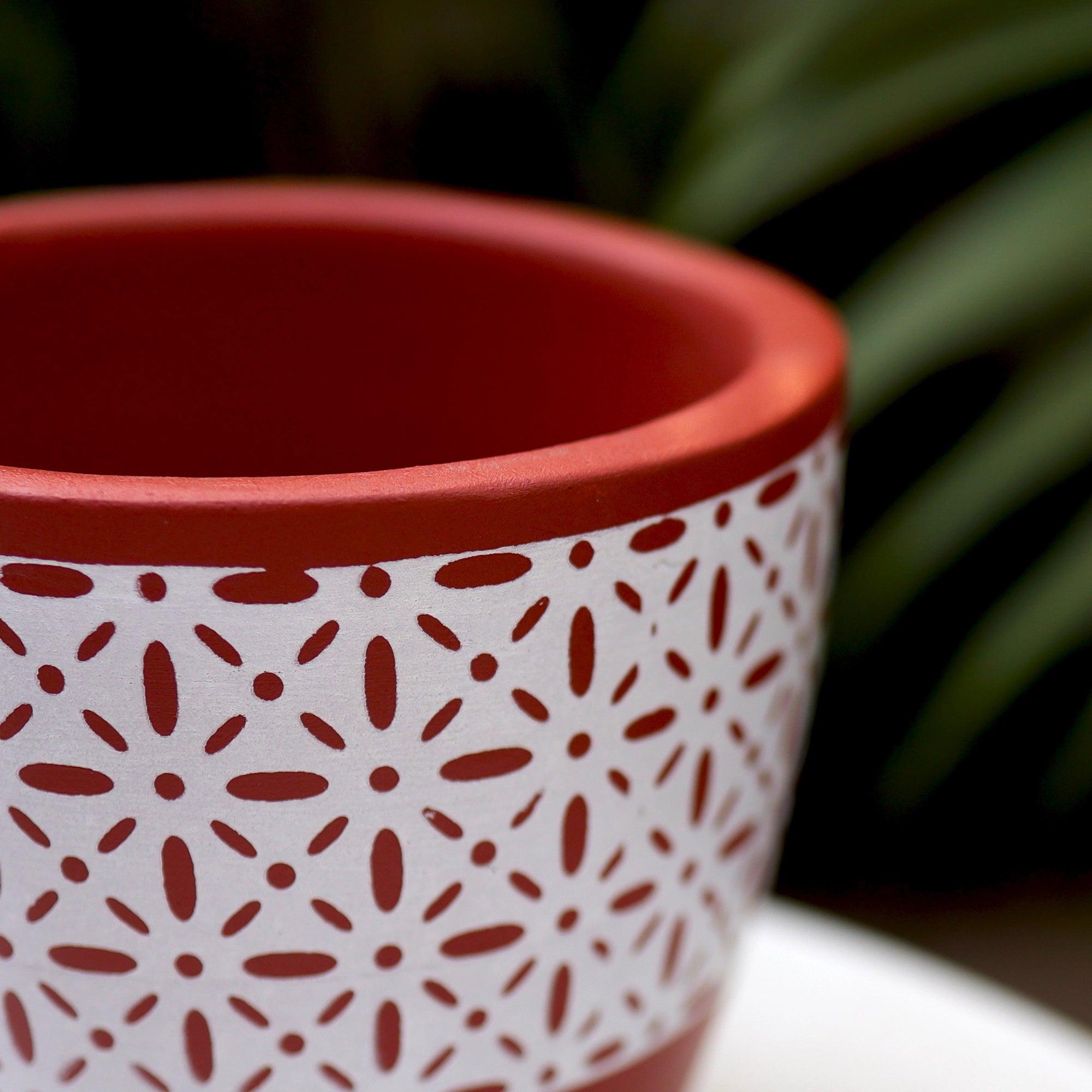 Hand-painted clay planter for indoor gardening